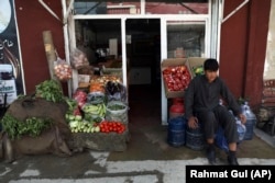 A young Afghan shopkeeper waits for customers in Kabul on August 22.