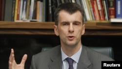 Russian billionaire Mikhail Prokhorov gestures during a news conference in Moscow on September14.