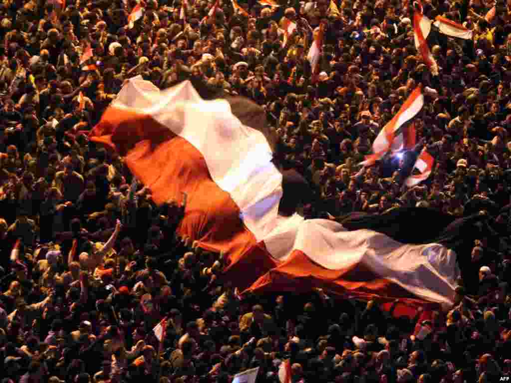 Antigovernment protesters celebrate in Cairo's Tahrir Square after Mubarak stepped down.