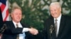 Former U.S. President Bill Clinton (left) and former Russian President Boris Yeltsin shake hands at the close of the Helsinki Summit on March 21, 1997.