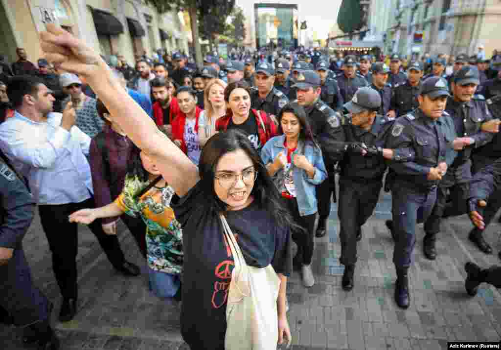 Police close in on the small group of protesters. A statement by the march organizers said the rally was held for &ldquo;the rights of women and young girls who have been deprived of education, married off, coerced, exploited, and committed suicide.&rdquo;&nbsp;