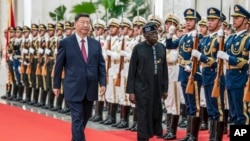 Chinese leader Xi Jinping (left) and Nigerian President Bola Tinubu attend a welcoming ceremony at the Great Hall of the People in Beijing on September 2 ahead of a China-Africa summit.