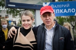 Valer Tsapkala, a former ambassador to the United States and founder of Minsk's Hi-Tech Park, with his wife, Veranika, in Minsk in May, before he was forced to flee the country.