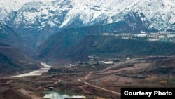 Construction of the dam near the Vakhsh River, seen on the left