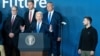 U.S. President Joe Biden speaks at the conclusion of the NATO summit in Washington on July 11, as Ukrainian President Volodymyr Zelenskiy (right) and other other foreign leaders look on.