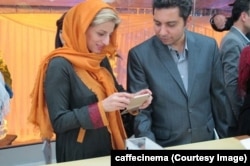 Customers at the opening of an official Apple store in Tehran in October 2014.