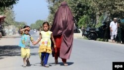 An Afghan family leaves Kunduz following clashes between Taliban and Afghan security forces.