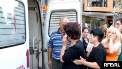 An injured woman at the "political walk"