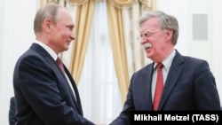 Russian President Vladimir Putin (left) meets with U.S. national security adviser John Bolton at the Kremlin in Moscow on June 27.