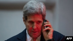 U.S. Secretary of State John Kerry talks on the phone in Vienna on November 21 during negotiations aimed at settling a dispute over Iran's nuclear program. 