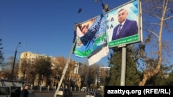 A billboard of presidential candidate Khatamjon Ketmanov -- one of three official candidates allowed to run against Mirziyaev.