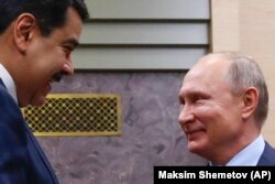 Venezuelan President Nicolas Maduro (left) and Russian President Vladimir Putin in Moscow on December 5