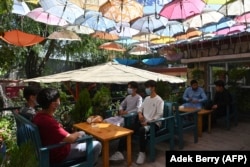 Young people at a cafe in Kabul on June 19.