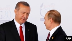 Turkish President Recep Tayyip Erdogan (left) greets Russian President Vladimir Putin prior to the G20 summit in Antalya in November 2015.