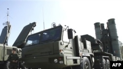 Russian soldiers examine the S-400 'Triumf' rocket systems