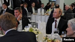 A popular Russian daily said the key issue in Michael Flynn's downfall was not his conversations with Sergei Kislyak but his participation in a gala celebration of Russian state broadcaster RT's 10th anniversary in Moscow in 2015, sitting at the same table with Vladimir Putin.