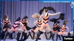 Local media reports said that the girls performed "a bees' dance" wearing orange-and-black striped costumes.