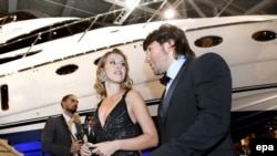 Ksenia Sobchak and TV celebrity Andrei Malakhov take part in the opening ceremony of the Millionaire Fair in Moscow in 2008.