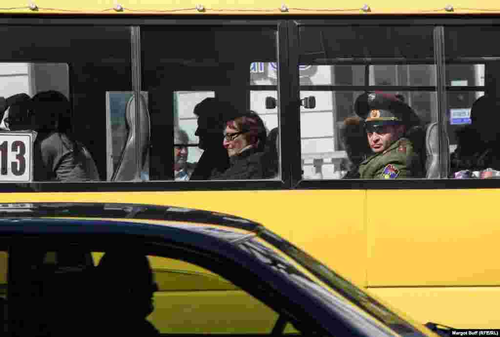 A military officer rides a bus in Stepanakert. The region is under the joint control of Armenian forces and the Nagorno-Karabakh Defense Forces, but few servicemen are seen in the regional capital.