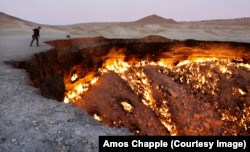 Photographer Amos Chapple at the edge of the Darvaza gas crater -- aka the Gates of Hell -- which has been burning since the 1970s.