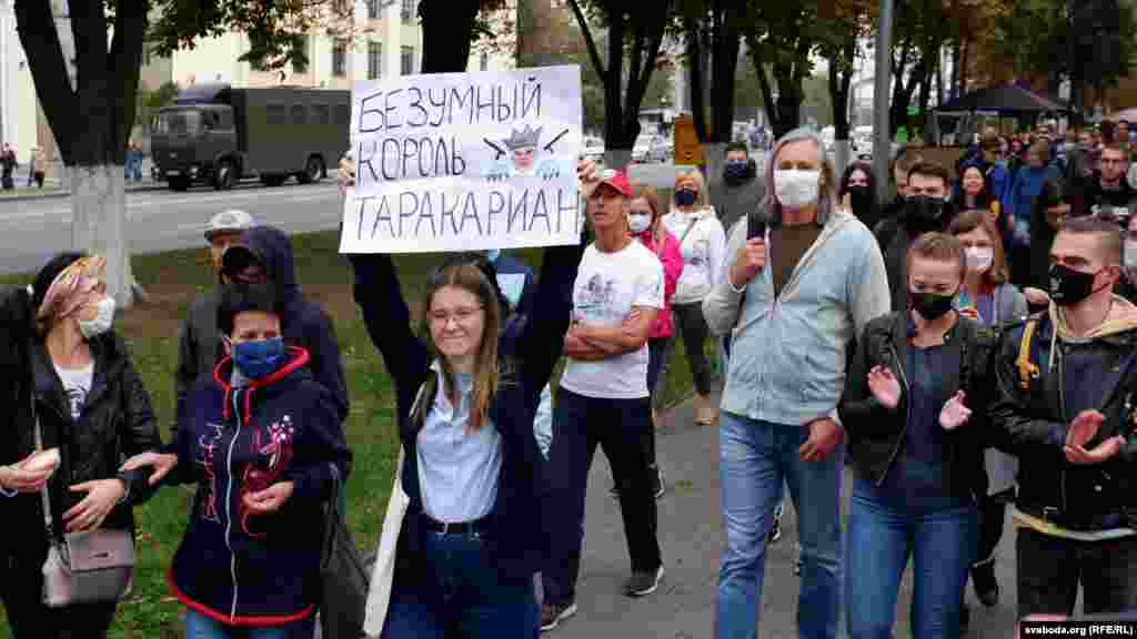 Mass protests took place in other cities of Belarus as well. In Homel the security forces used tear gas and a flash-noise flare gun against participants of the peaceful march. People were violently detained. The sign reads &quot;Crazy cockroach king.&quot;