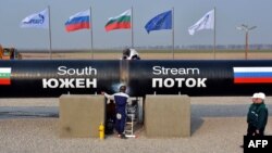 Workers weld pipes during the symbolic start of the construction of the Bulgarian section of the South Stream pipeline near the Bulgarian village of Rasovo on October 31, 2013.