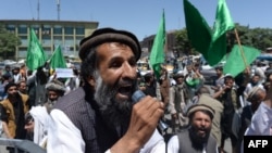 An Afghan demonstrator shouts slogans in support of presidential candidate Abdullah Abdullah in Kabul on June 22. With allegations of fraud circulating, some lawmakers feel social media may be fanning the flames of tension surrounding the hotly contested election. 