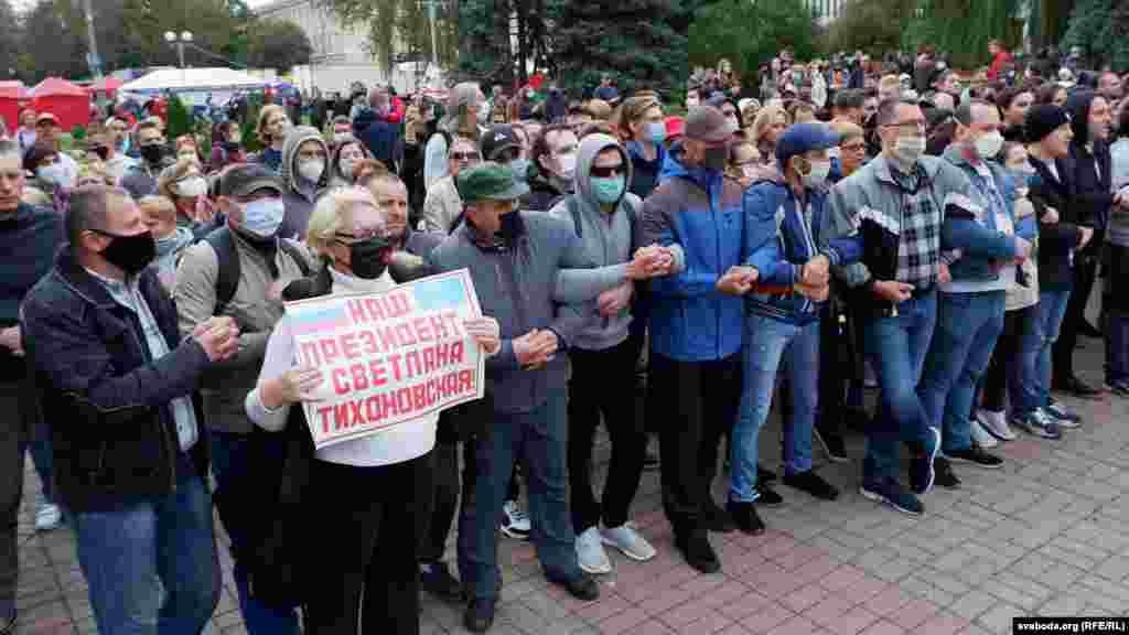 A protester in Homel holds a sign that reads, &quot;Our president is Svyatlana Tsikhanouskaya.&quot;