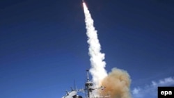 A missile is launched from the Aegis-combat-system-equipped destroyer "USS Decatur" during a Missile Defense Agency ballistic-missile flight test in 2007.