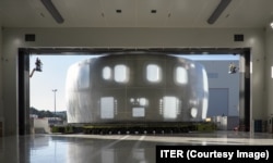 Part of the massive stainless-steel container that will enclose the International Thermonuclear Experimental Reactor arrives at its facility in southern France in August.