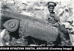 A boy poses next to one of Julfa’s rams in 1915.