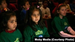 Children attend a prelaunch promotional event in Afghanistan for "Baghch-e-Simsim."