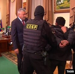 In the video, suspect Orkhan Zeynalov is marched in front of Russian Interior Minister Vladimir Kolokoltsev (left).