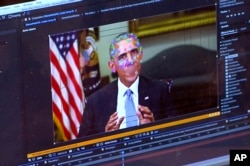 This image made from video of a fake video featuring former President Barack Obama shows elements of facial mapping used in new technology that lets anyone make videos of real people appearing to say things they've never said.