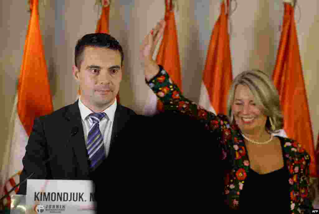 Gabor Vona (left), the chairman of Hungary&#39;s far-right Jobbik (Better) party, and party colleague&nbsp;Krisztina Morvay speak in Budapest. The party won some 15 percent of the vote.