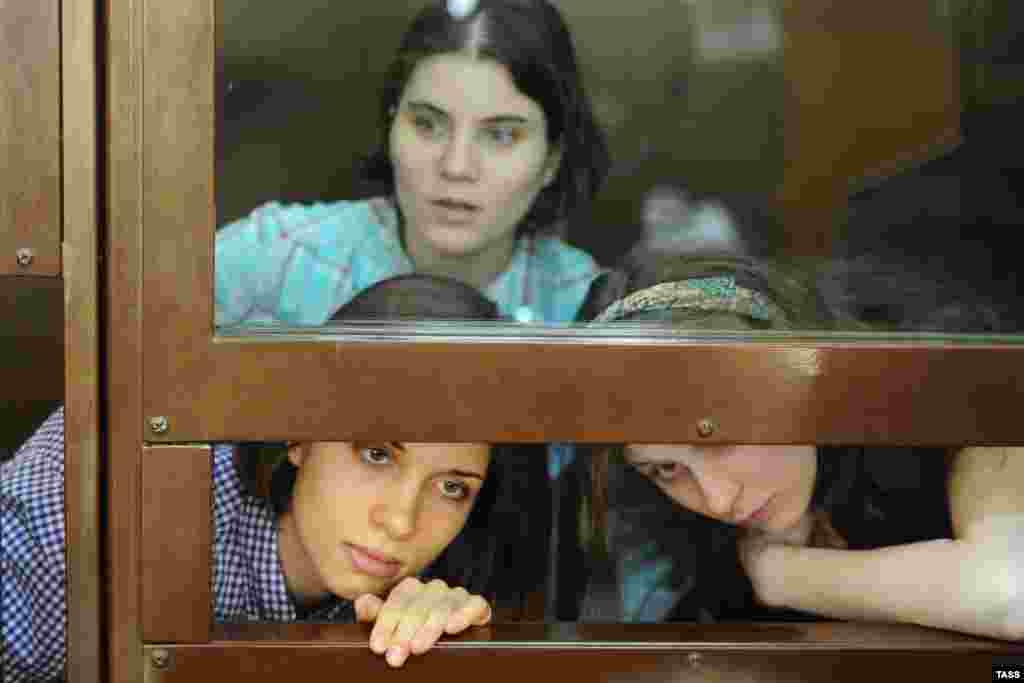 Members of Pussy Riot: Nadezhda Tolokonnikova (left), Yekaterina Samutsevich (top), and Maria Alyokhina in court on July 30