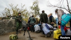 The report says separatist groups controlling parts of the Donetsk and Luhansk regions "continue to deprive people of their basic rights and of any effective mechanism for redress."