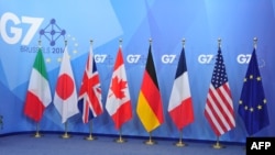 The flags of the G7 countries are seen ahead of the summit at the European Council headquarters in Brussels on June 4. 