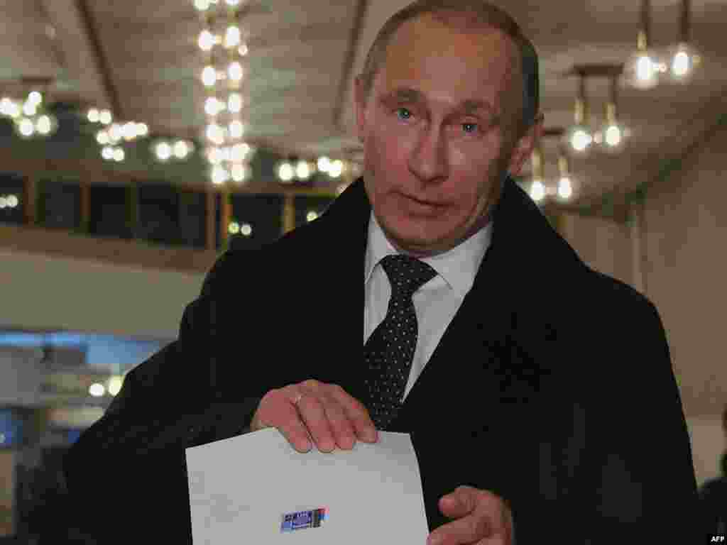 Russian Prime Minister Vladimir Putin votes.