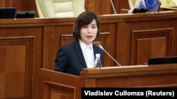 Moldovan Prime Minister Maia Sandu delivers a speech to parliament in Chisinau on November 12.