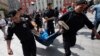 Police officers detain a protester in Moscow last year. According to Freedom House, 2015 saw Russia and other authoritarian regimes "crack down harder on dissent."