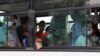 People wearing protective face masks inside a bus in Ashgabat, the capital of Turkmenistan where the coronavirus officially does not exist. 