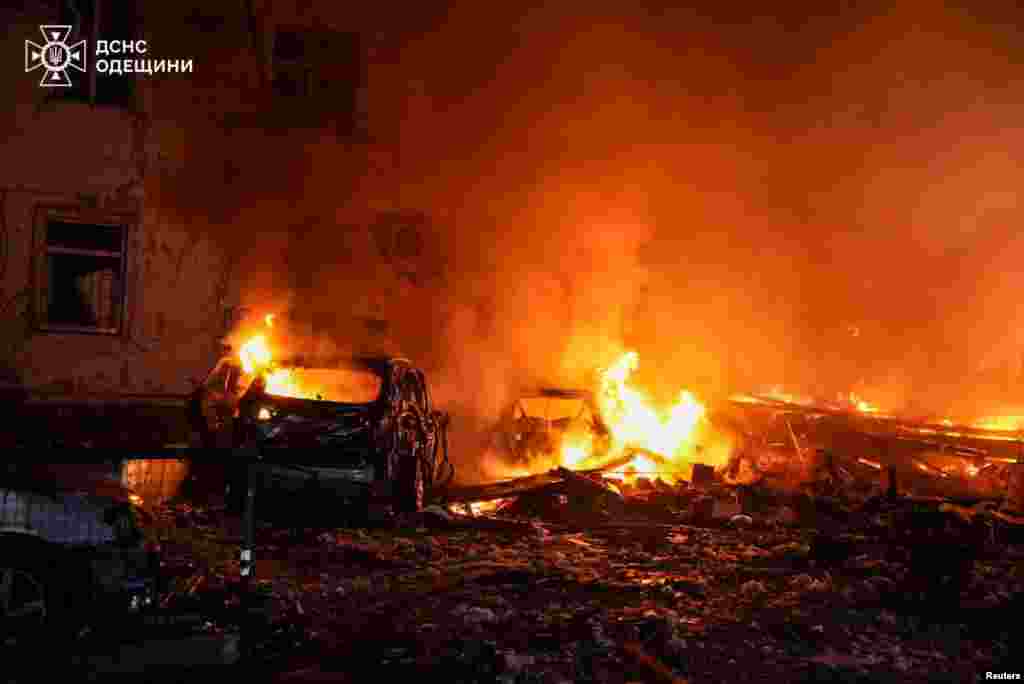 Cars burn after a Russian drone attack on the Ukrainian port city of Odesa. 