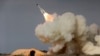 The image shows an S-200 missile fired during a military drill in Iran