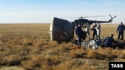 A search-and-rescue team at the landing site on October 11