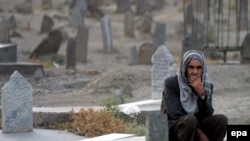 A man at Kabul's graveyard for Afghan "martyrs" in the fight against Soviet troops in September 2006