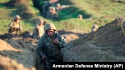 Armenian soldiers take up positions on the front line in the Tavush region on July 14.