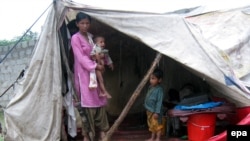 Flood victims live in temporary shelters as it rains in Muzaffarabad in the Pakistani-administered Kashmir region.