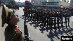 Soldiers of the breakaway territory of Transdniester take part in a military parade during Independence Day celebrations in Tiraspol on September 2, 2012.