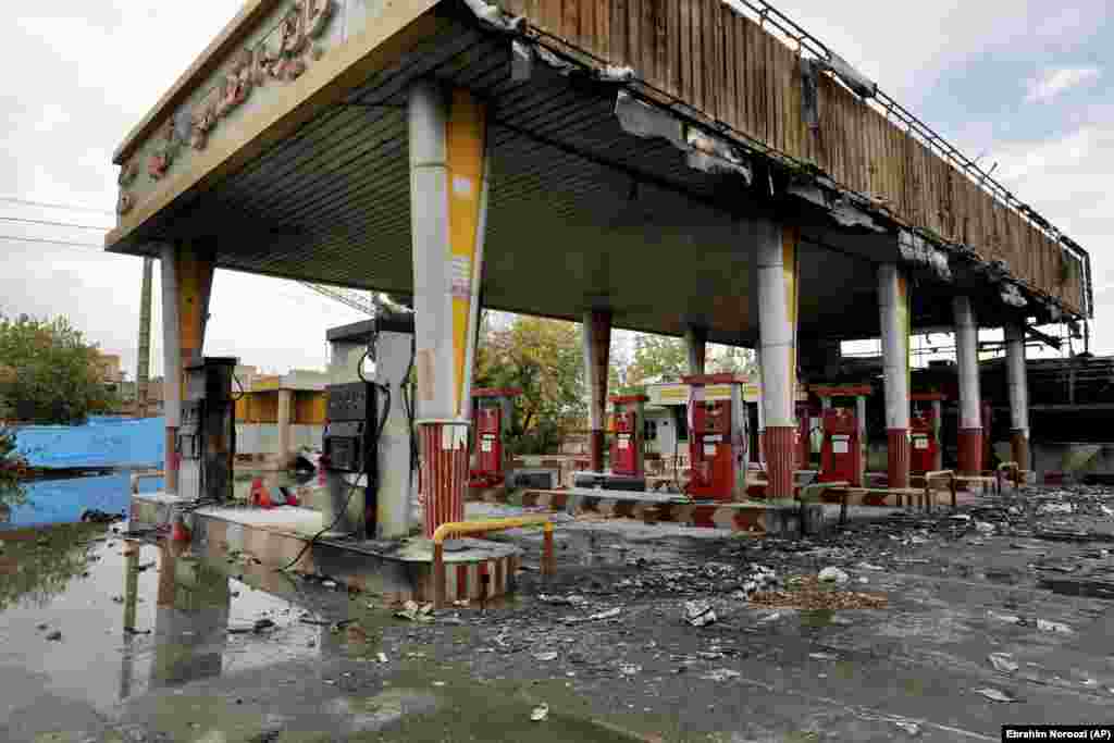 A heavily damaged gas station in Tehran. There have been unconfirmed reports that as many as 200 people were killed in the demonstrations nationwide. Amnesty International, citing eyewitness accounts, reported security personnel shooting into crowds from rooftops and &quot;in one case, a helicopter.&quot;